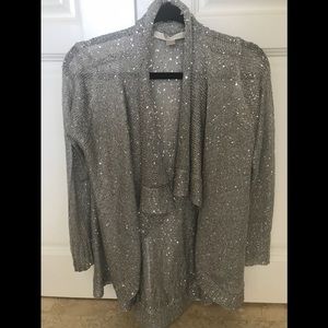 Draped silver sparkly sweater.